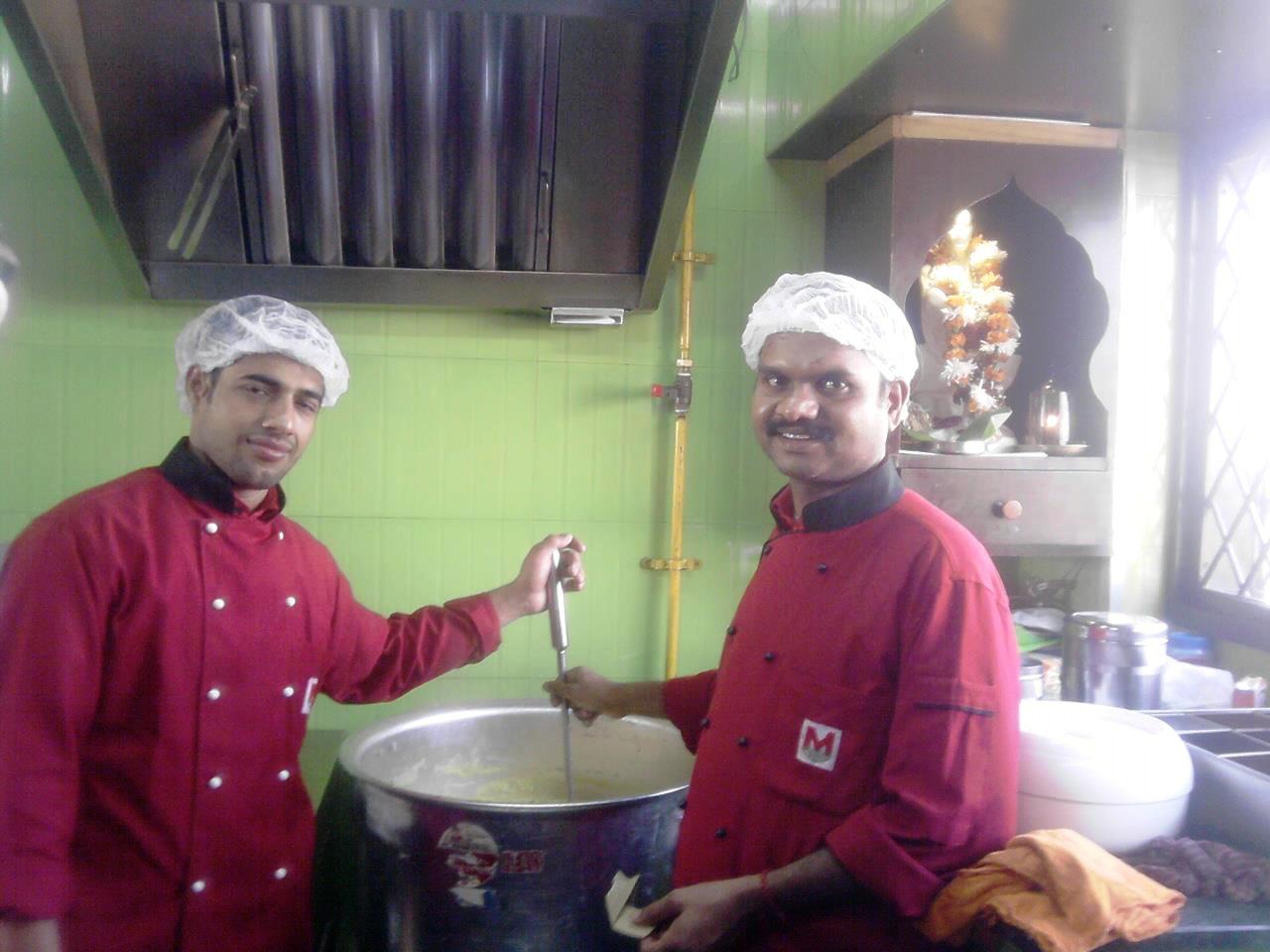 Chefs of Madhuban preparing food.